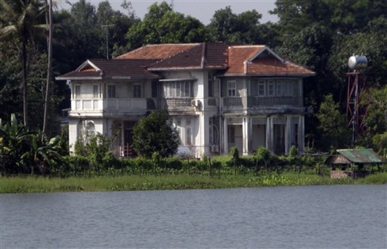 The lakeside home of Myanmar's detained opposition leader Aung San Suu Kyi is seen on Thursday, Nov. 11, 2010, in Yangon, Myanmar. Suu Kyi suffered her latest courtroom loss Thursday but close aides remained optimistic that she will soon be granted freedom from house arrest in the military-ruled country. (AP Photo/Khin Maung Win)
